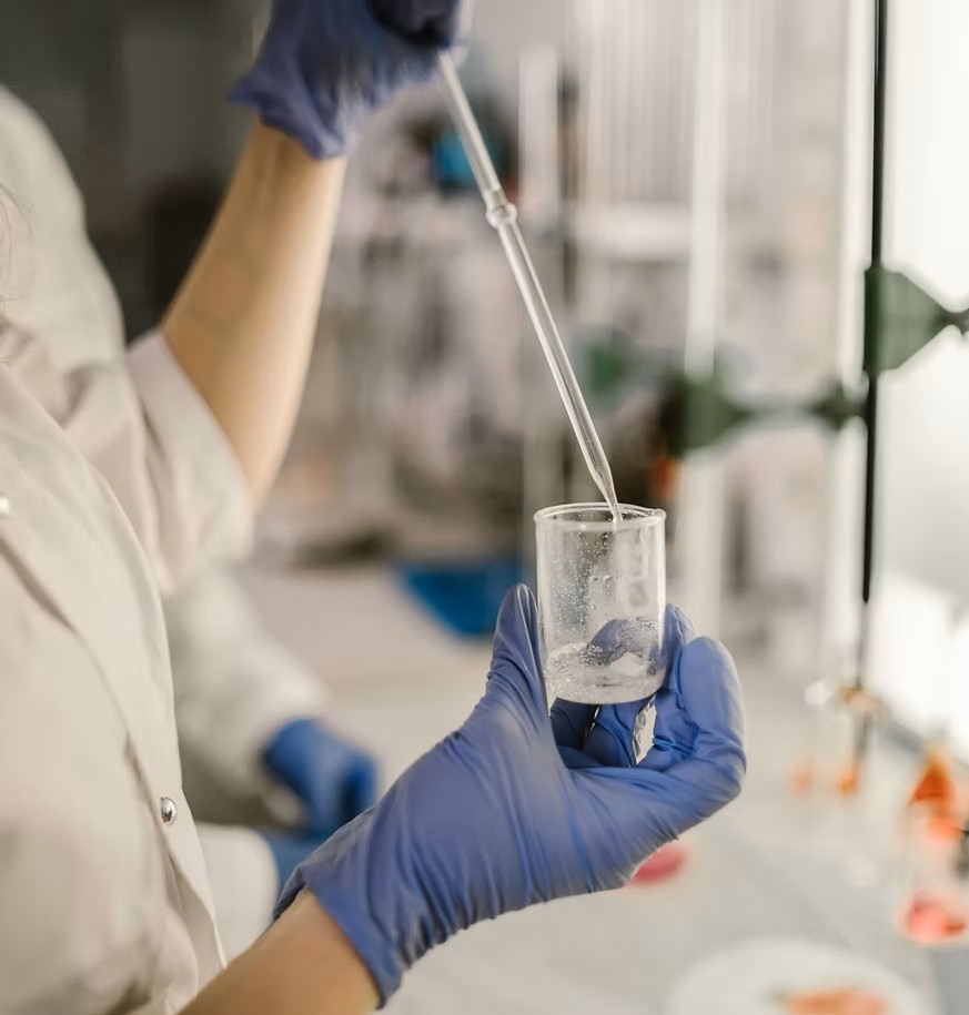 Scientist working in a laboratory with chemical formulations